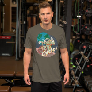 Man in a gym wearing an army green t-shirt with an illustration of an astronaut with the caption "cycles" and holding up a victory sign